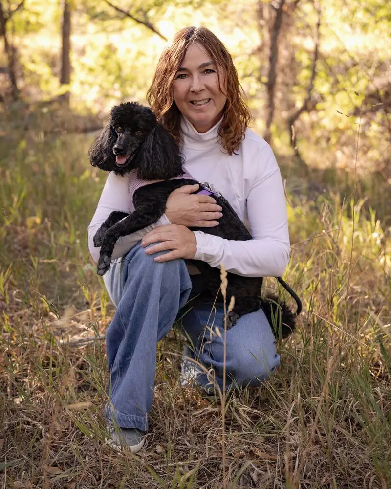 Melissa Hunt with her miniature poodle, Bree